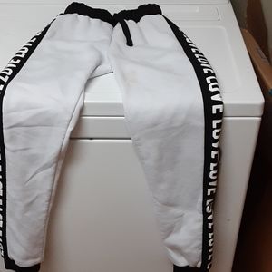 White and black pants with love down the side